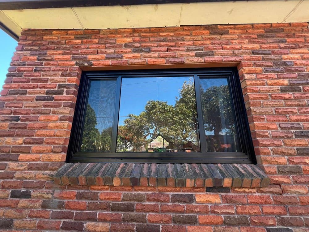 Black Frame Window, Red Brick House