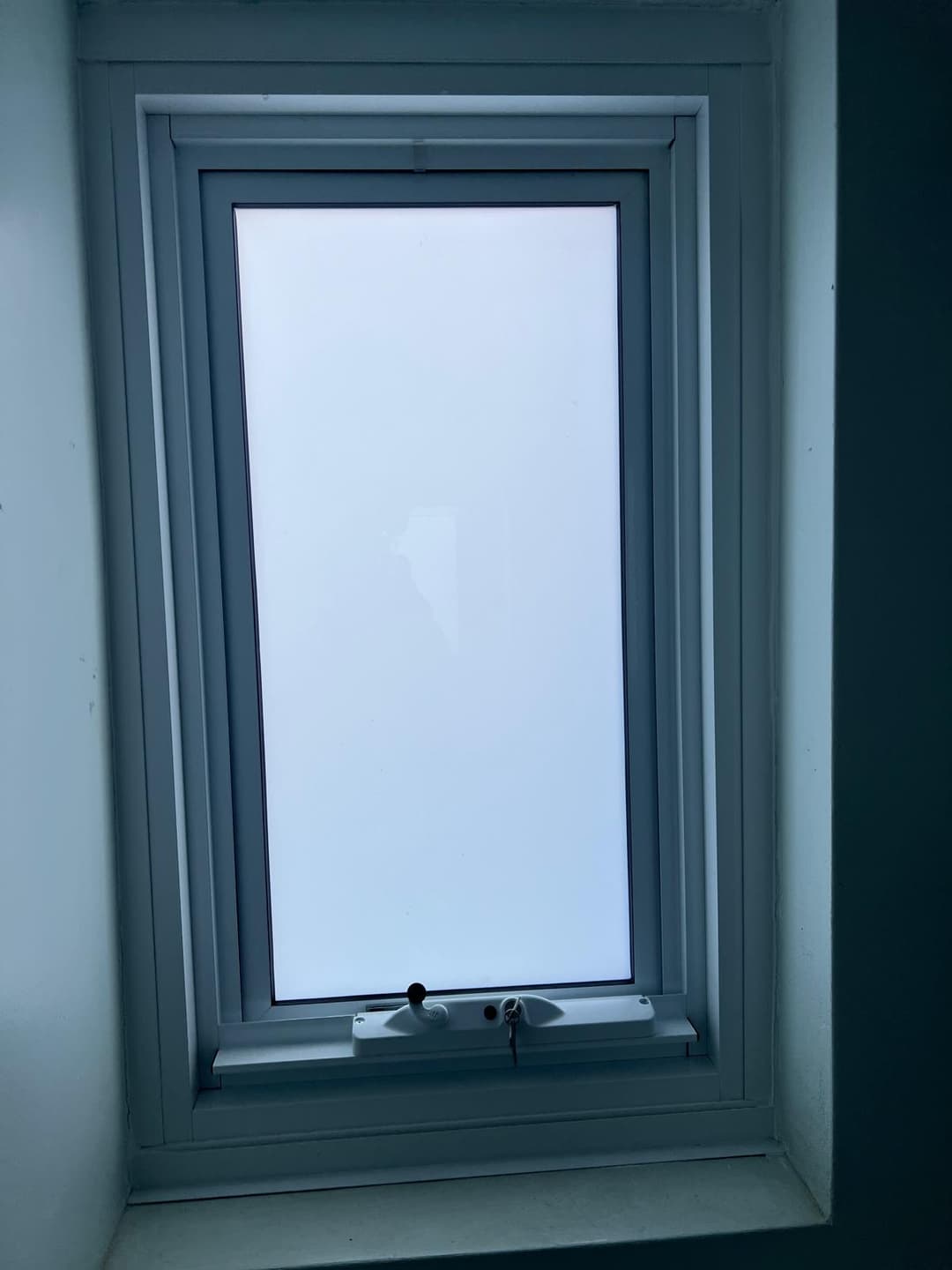 Frosted Awning Window, White Tile Bathroom