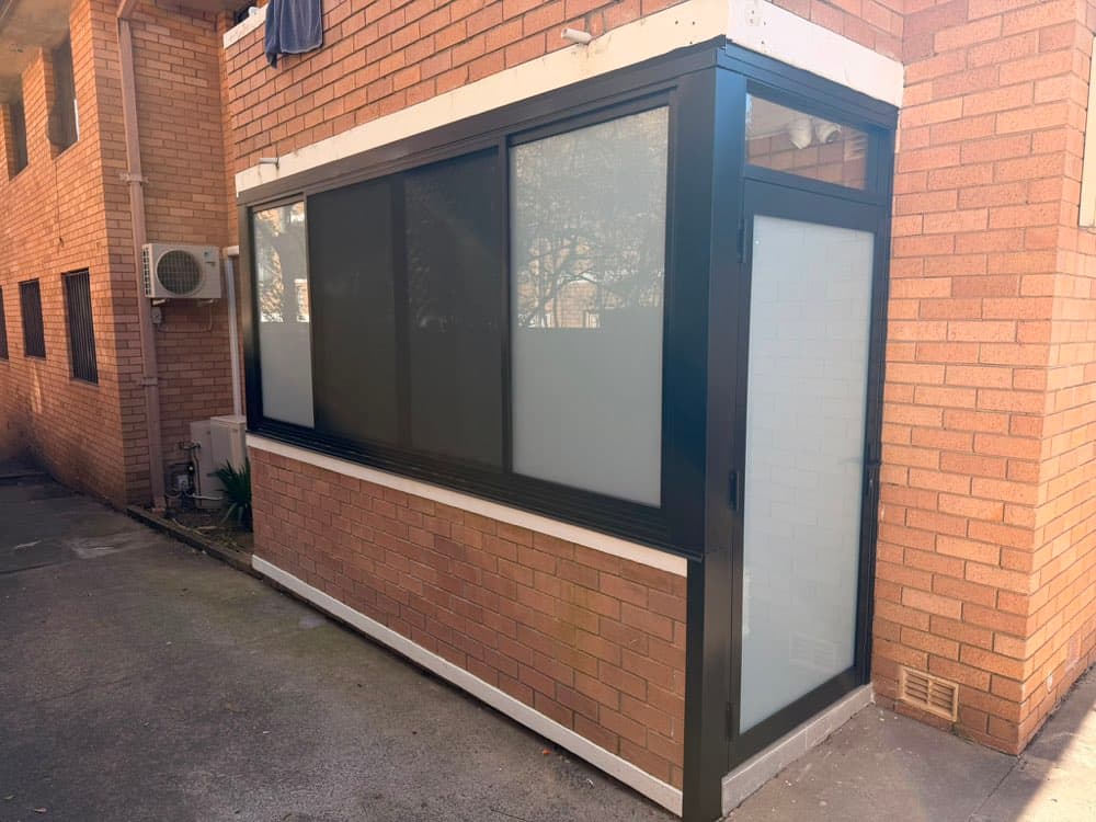 Black Frame Bay Window, Brick Apartment