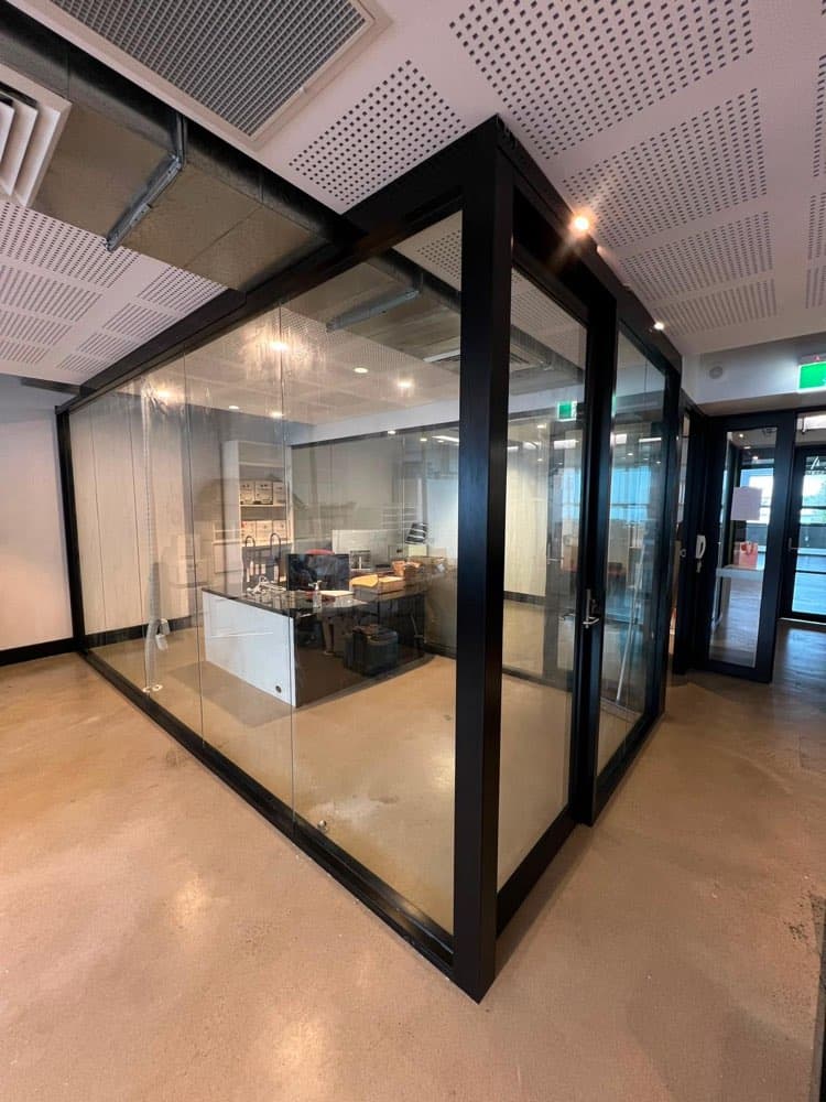 Black-framed commercial glass partition